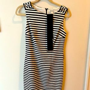 Eye catching black and white dress with button accent on top with belt